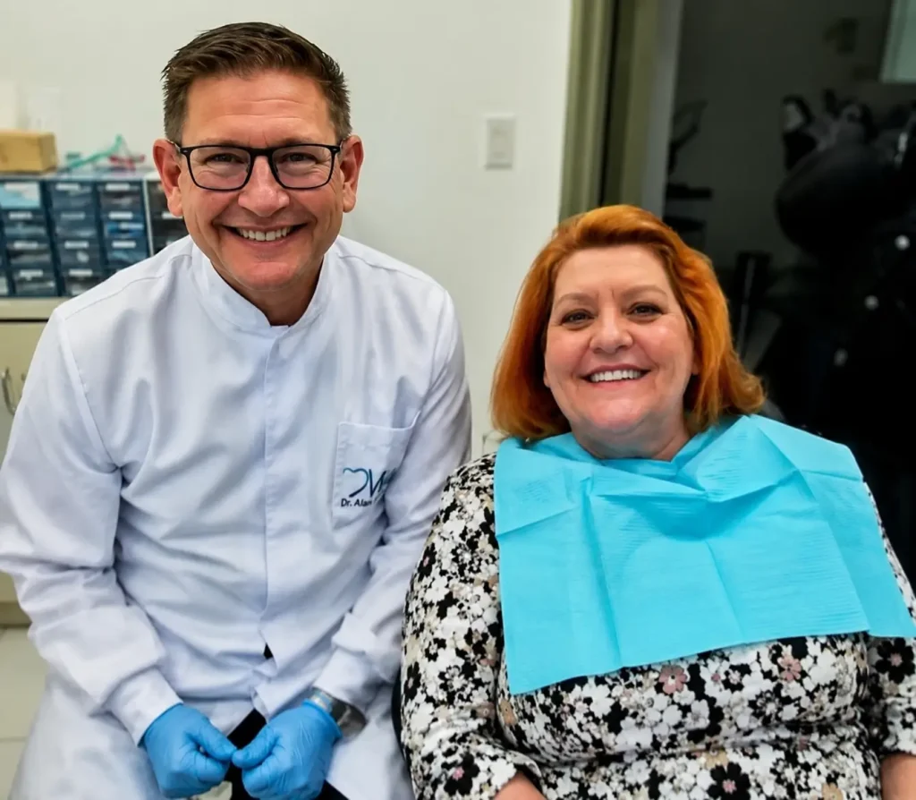 Dr. Alan Martinez with patient after successful dental implant and smile restoration treatment at Dr. Mexico Dental Group in Tijuana, Mexico