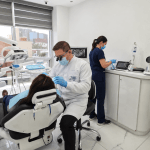 Dentist providing treatment to a patient at Dr. Mexico Dental Group in Tijuana, Mexico.